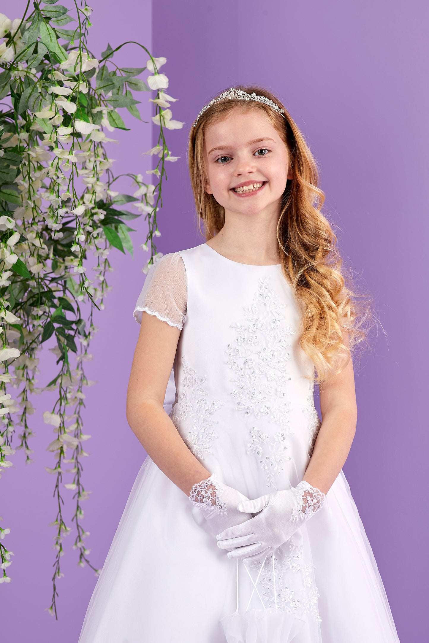 Sabrina White Holy Communion Dress featuring Embellished Motifs and Lace Edged Hem Available October 2026